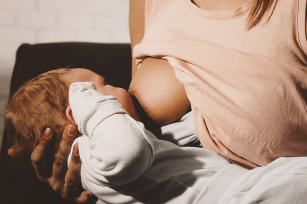 Mother breastfeeding a young baby